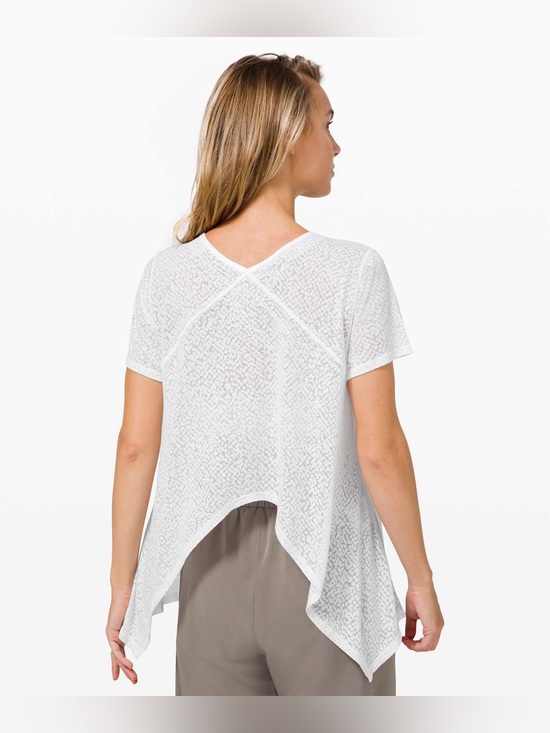 lululemon athletica Tops - WHITE LULULEMON SEE
THROUGH SHORT SLEEVE TOP